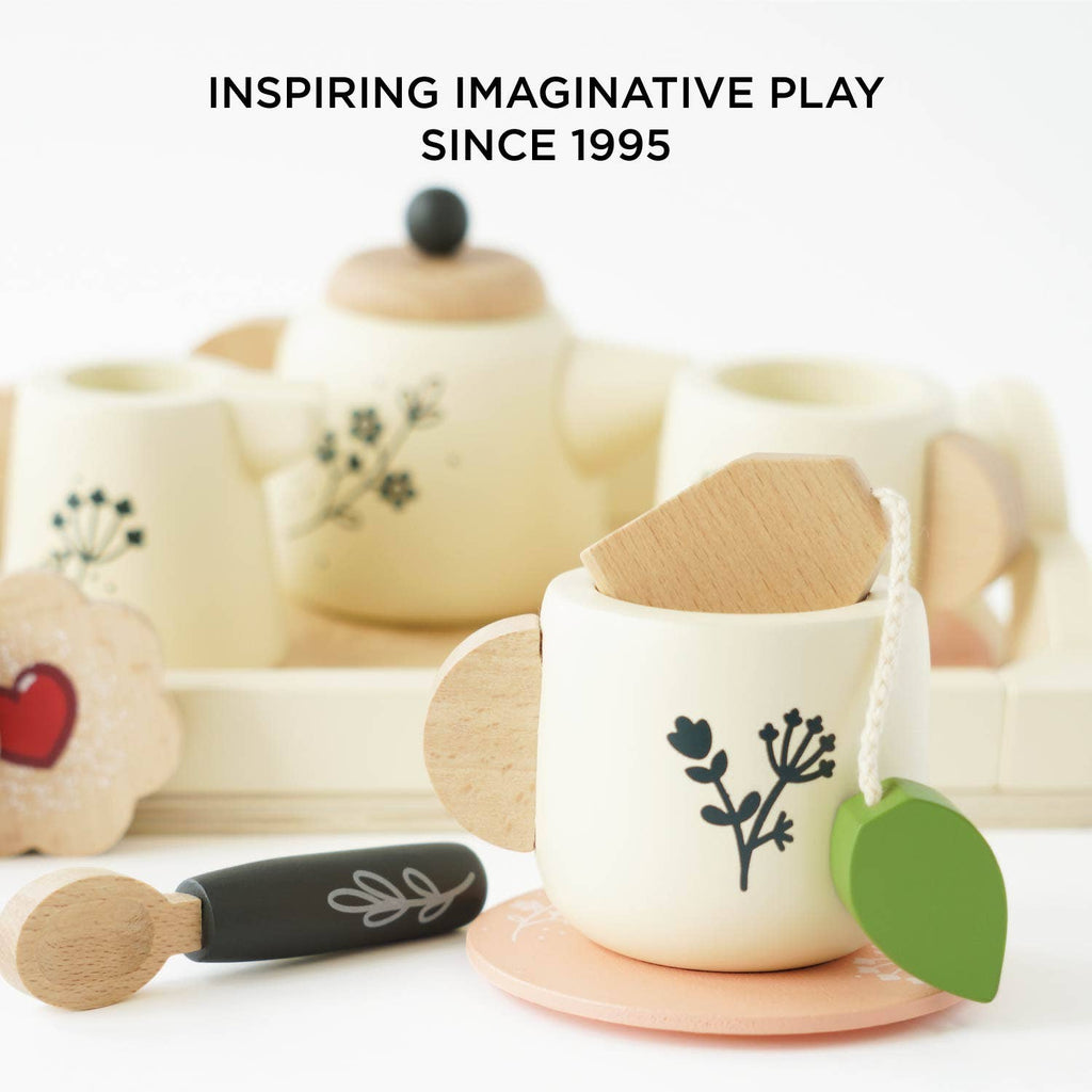 Children's tea set with cups, saucers, and a spoon on a white background, featuring the text 'Inspiring Imaginative Play Since 1995'.