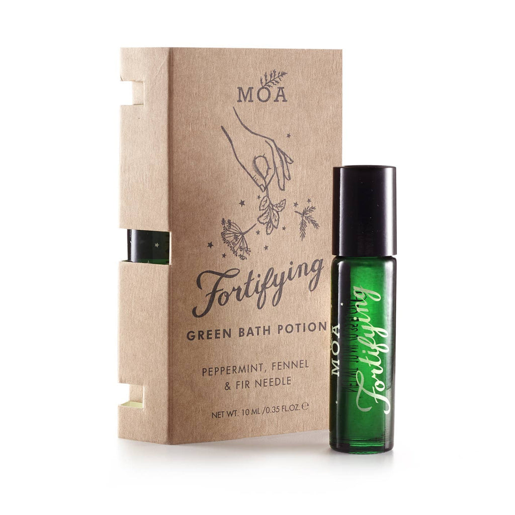 Green bottle of MOA Fortifying Green Bath Potion with brown box on a white background