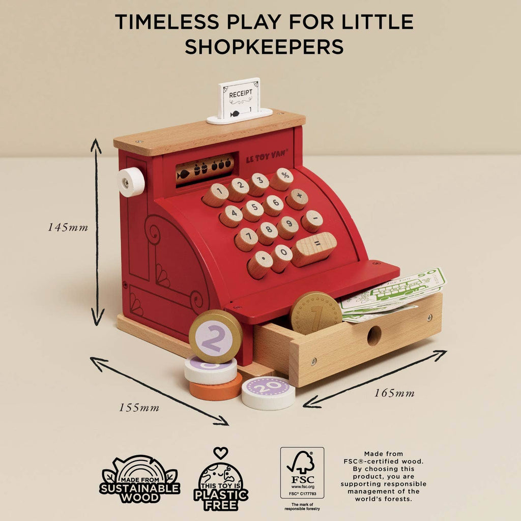 Wooden toy cash register with measurements and sustainability certifications on a beige background