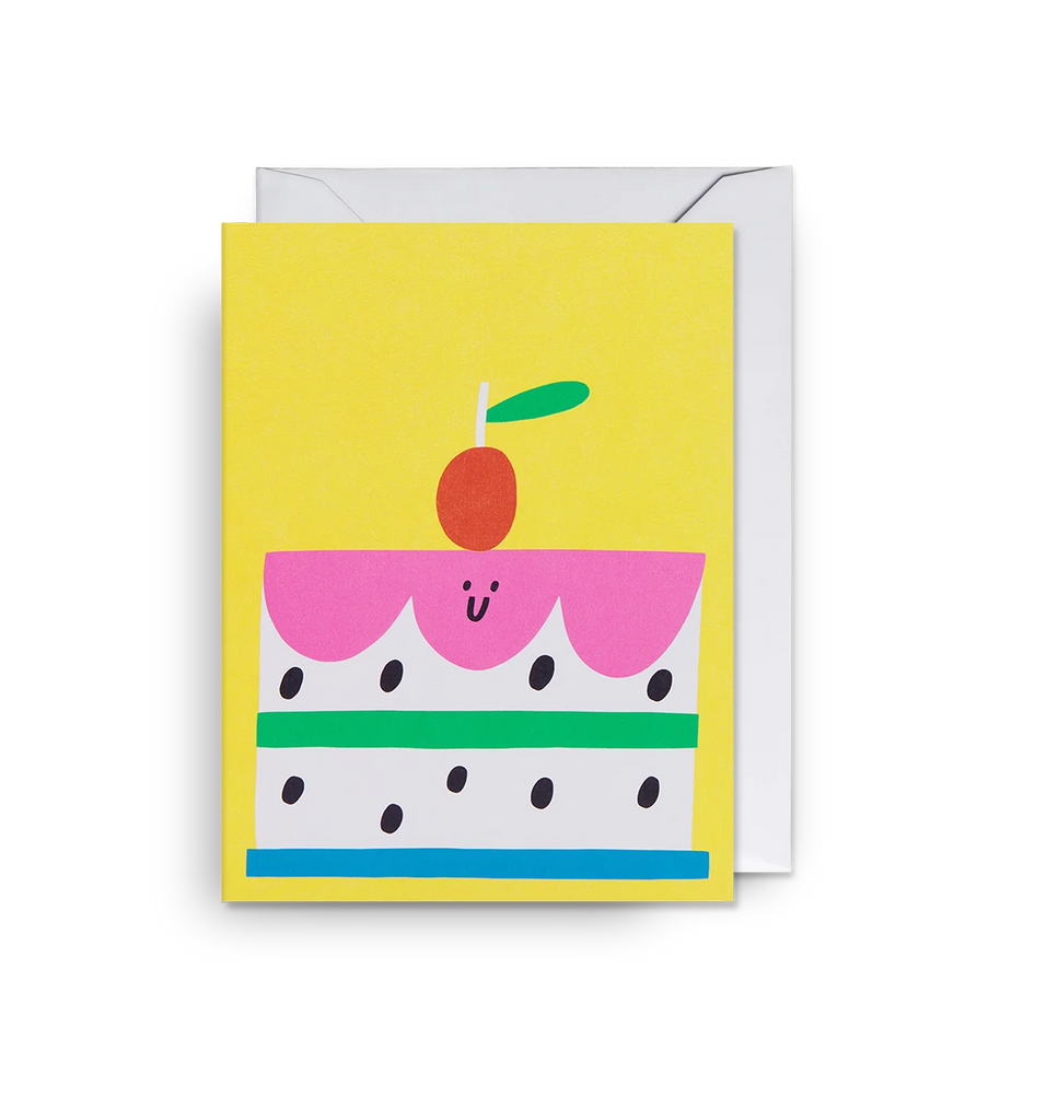 A bright and happy mini card featuring an illustrated cake by artist Susie Hammer on a sunny yellow background, designed for Lagom.