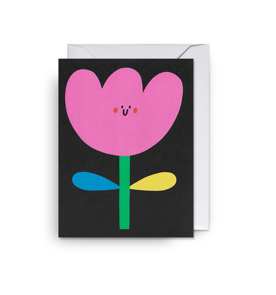 A  black mini card with a colour-block flower illustration by Susie Hammer. 