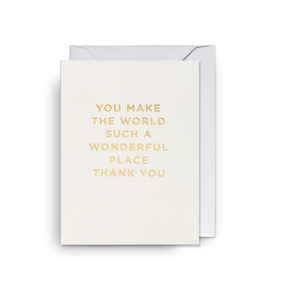 A white mini greetings card from Lagom Design with a gold foil message that reads 'You make the world such a wonderful place, thank you'
