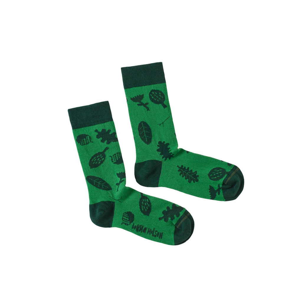 Green socks with black patterns on a white background