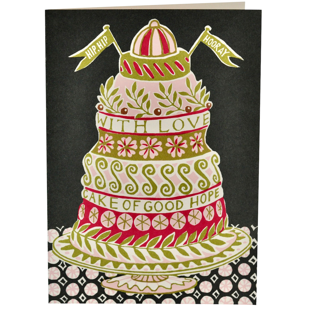 Greetings card from Cambridge Imprint featuring a green, pink and white patterned cake design on a black background, with the words 'Hip, Hip Hooray... Cake of Good Hope'
