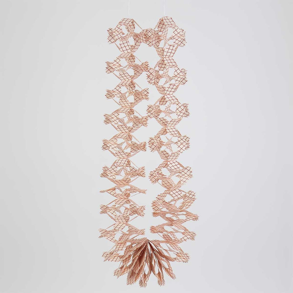 Decorative red and white paper Christmas garland featuring a criss-cross pattern