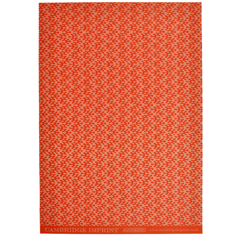 Orange and pale pink kelp print wrapping paper full roll