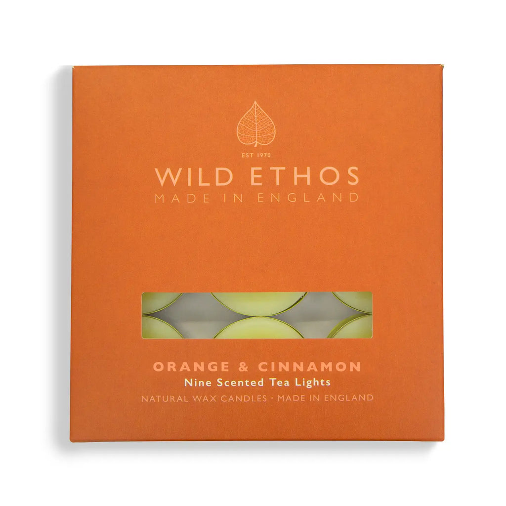 Orange box of Wild Ethos scented tea lights with a clear window showing the candles inside.