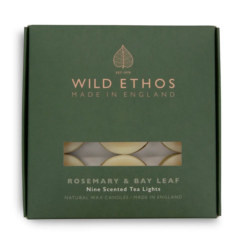 Green box of Wild Ethos rosemary and bay leaf scented tea lights on a white background