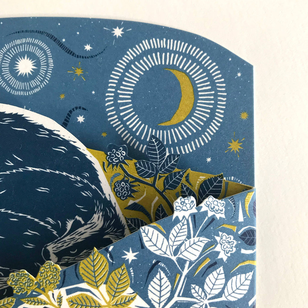 Decorative paper with celestial design featuring moon, stars, and floral elements.