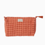 terracotta and pink gingham toiletry pouch, with a tassel zip