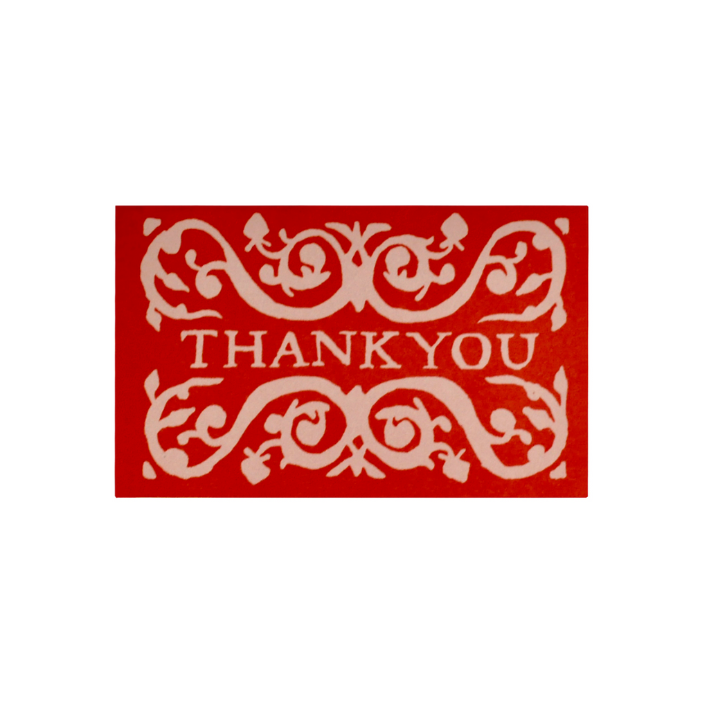 Red card with white decorative text 'THANK YOU' on a white background