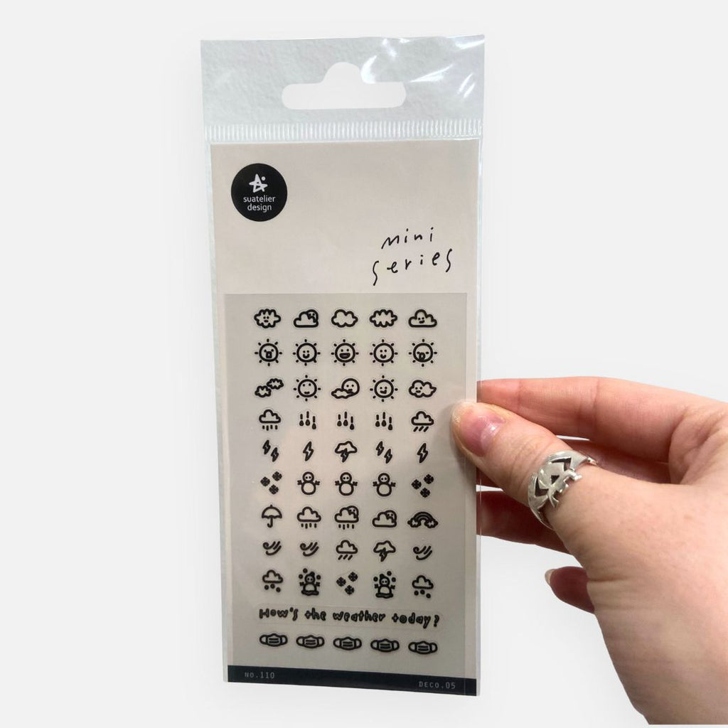 Packaged mini series weather-themed nail art stickers held by a hand with a ring.