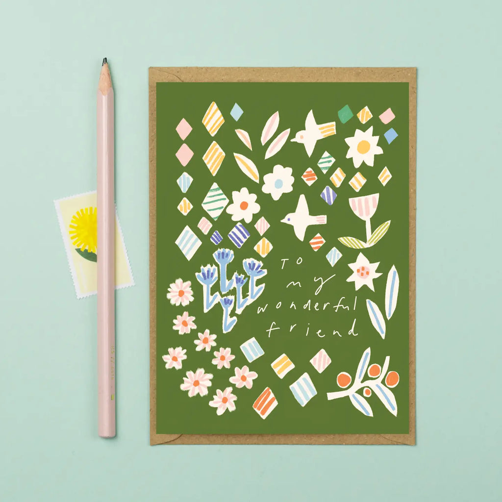 Greeting card with floral design and 'To my wonderful friend' text on a green background