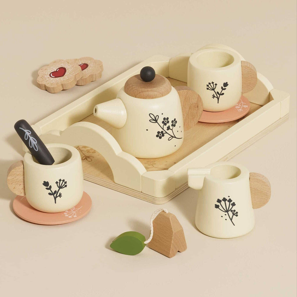 Wooden toy tea set with cups, teapot, and tray on a light background