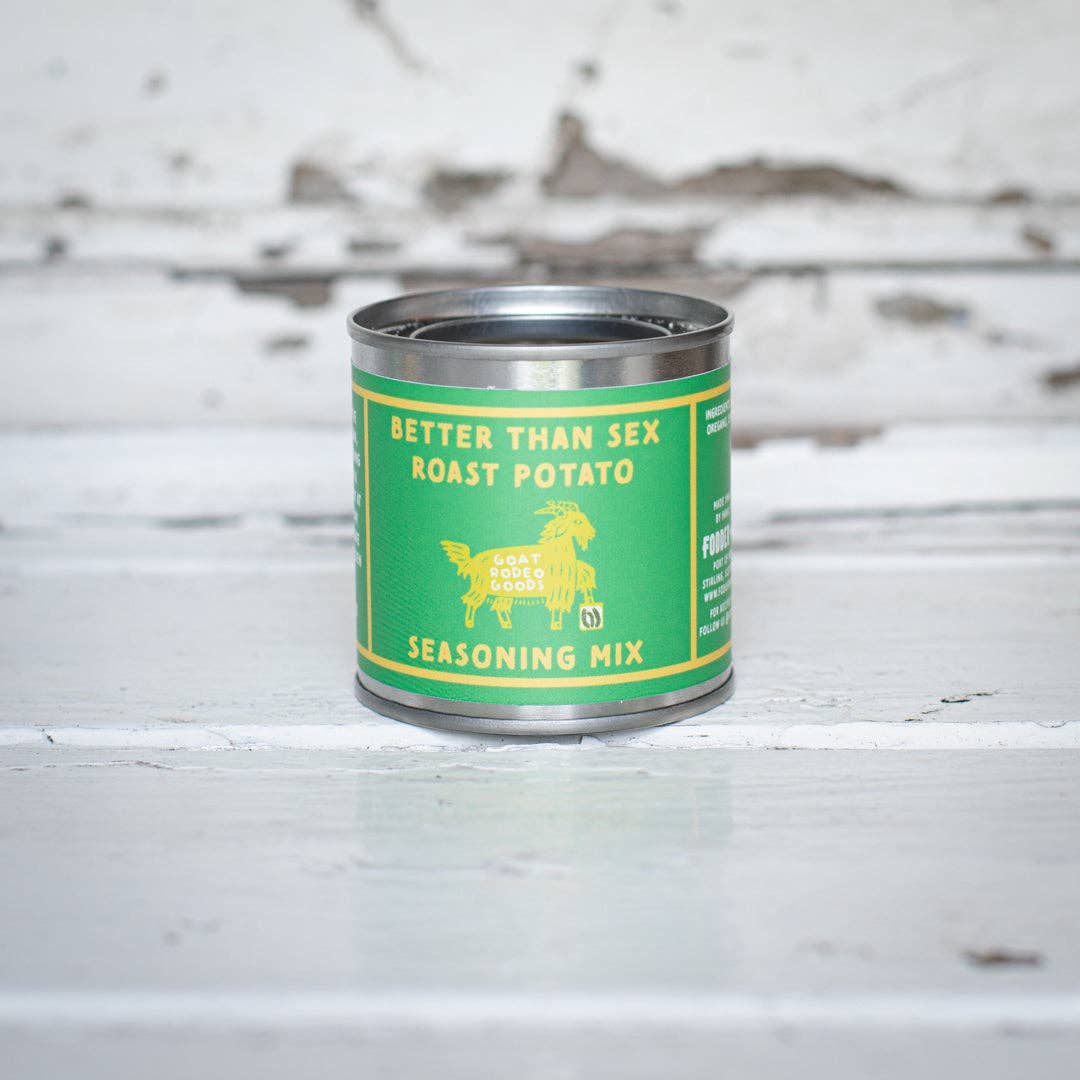 Can of roast potato seasoning mix with green label on a wooden surface