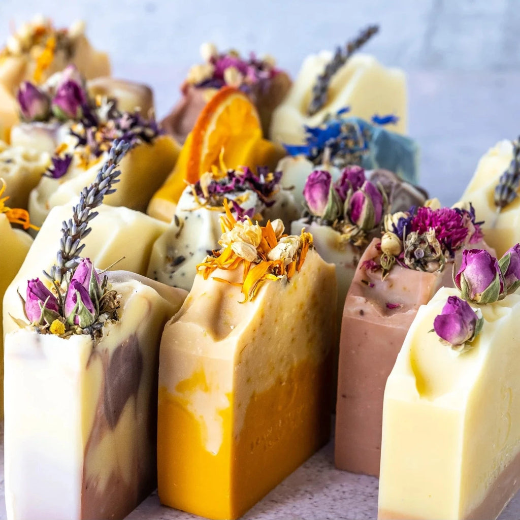 Bars of natural, handmade soap decorated with dried botanicals.  