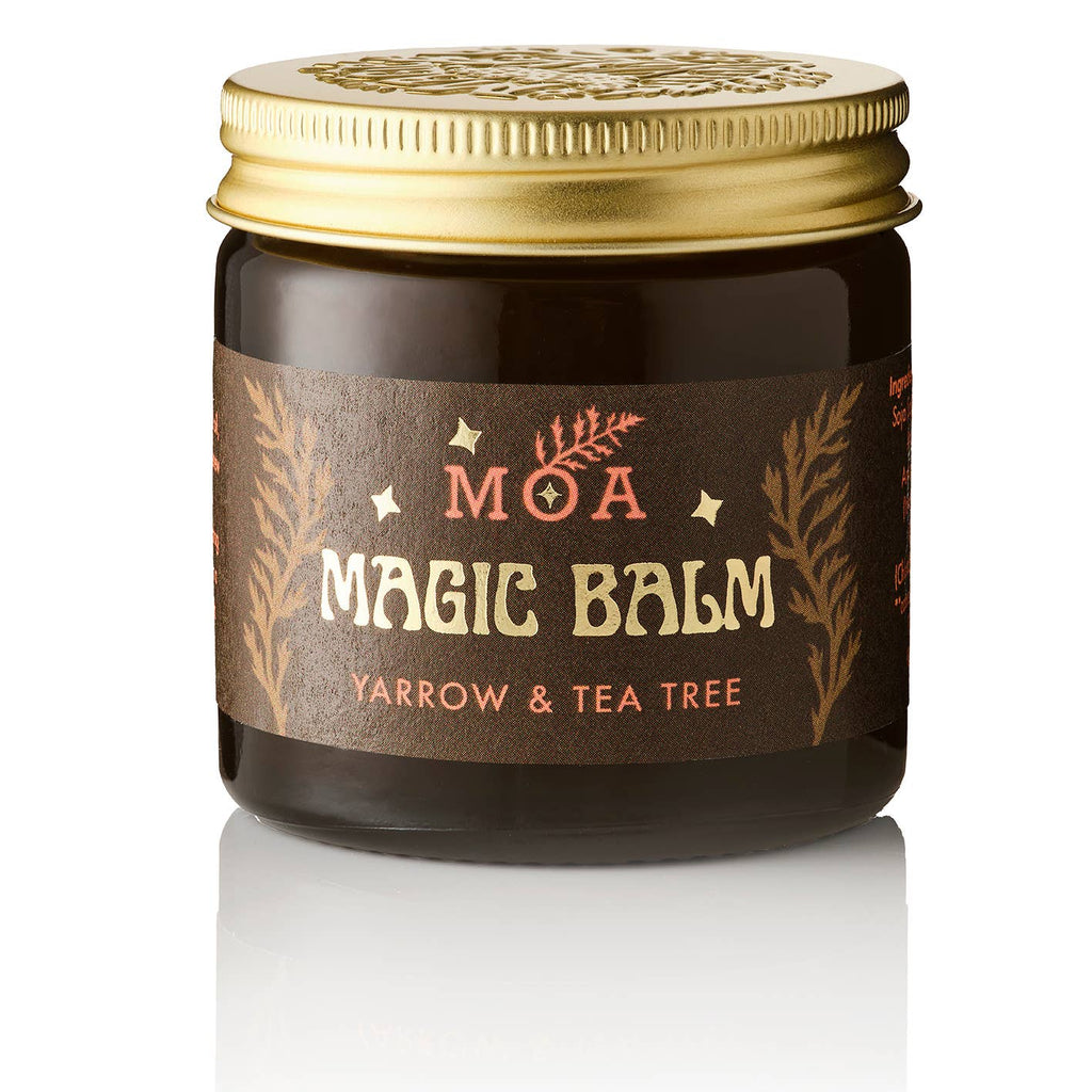 Jar of MOA Magic Balm with gold lid on a white background