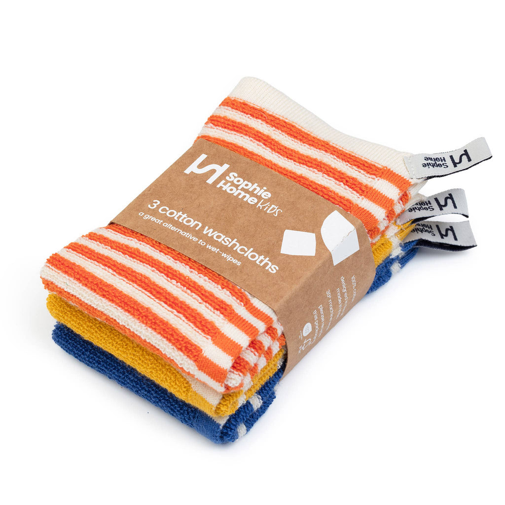 Pack of three cotton washcloths with colorful stripes in a brown package on a white background