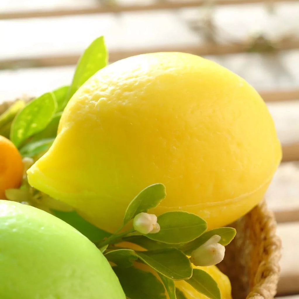 A lemon-shaped soap, in a woven basket