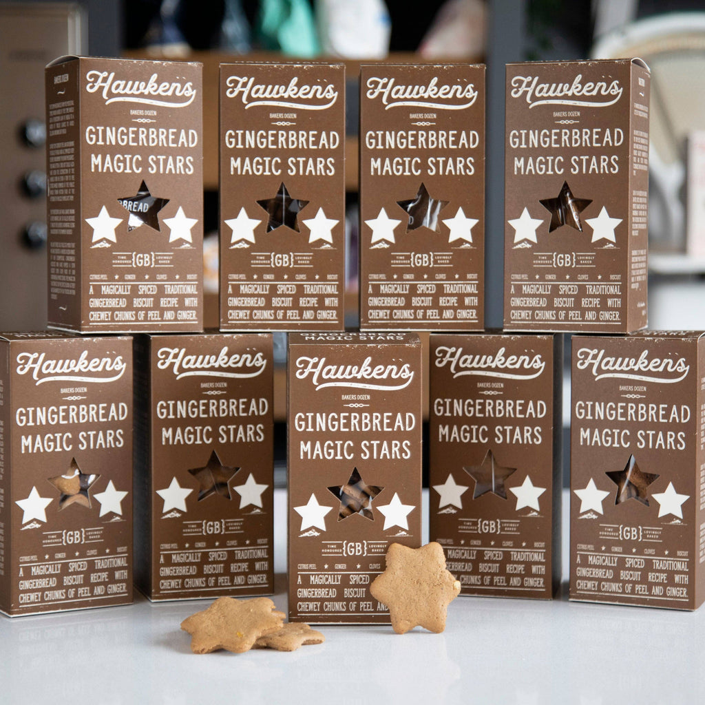 Packaging of Hawker's Gingerbread Magic Stars on a white surface with a blurred background.