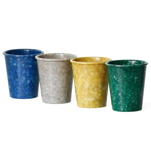 Four marbled cups in blue, grey, yellow, and green on a white background