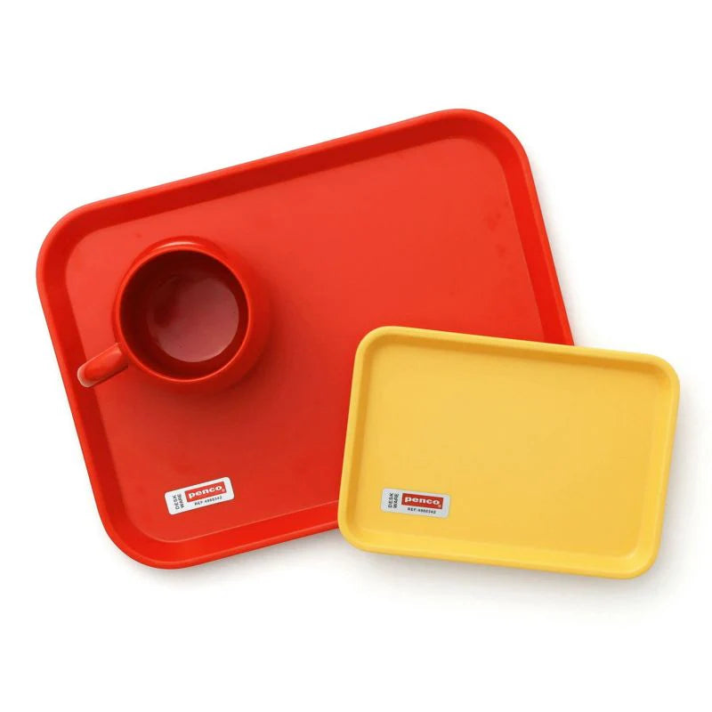 Red and yellow trays with a red cup on a white background