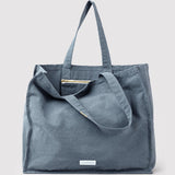 les pensionnaires - large canvas tote bag in horizon blue - winter's moon