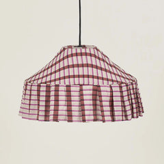 Mosaic patterned fabric pendant lampshade, with a black electrical cord against a neutral, cream background.