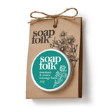 Soap Folk massage balm packaging with a brown paper bag on a white background
