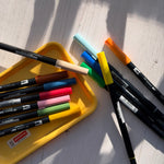 tombow abt - variety of coloured pens on white background - winter's moon