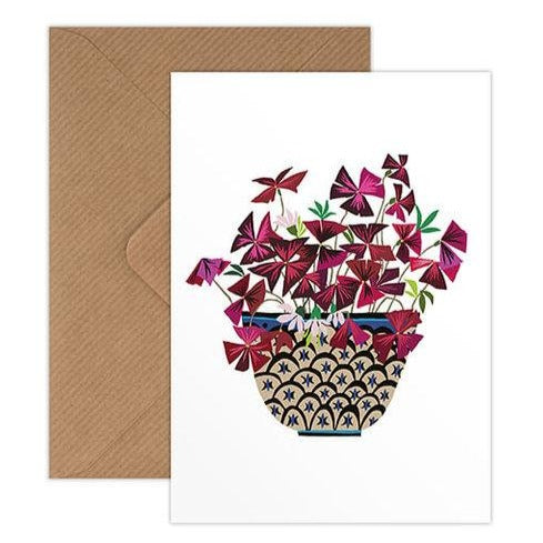 greetings card designed by brie harrison detailing an purple oxalis plant coming out of a vase.  