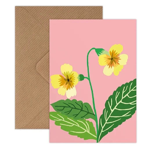 Greetings card by Brie Harrison of a Spring flower illustration on a pink background. Shown with a kraft brown envelope.