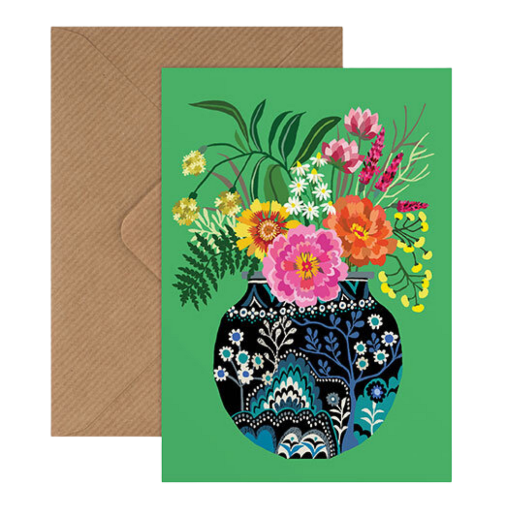 Botanical inspired card by Brie Harrison featuring colourful flowers in navy and blue decorative jug on a green background.