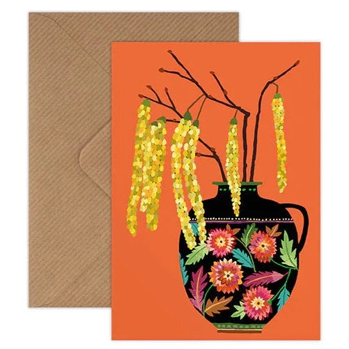Greetings card by Brie Harrison featuring illustrated catkins branches, diisplayed in a panted floral vase on an orange background. Card is blank for your own message.