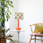 orange table lamp with block printed shade